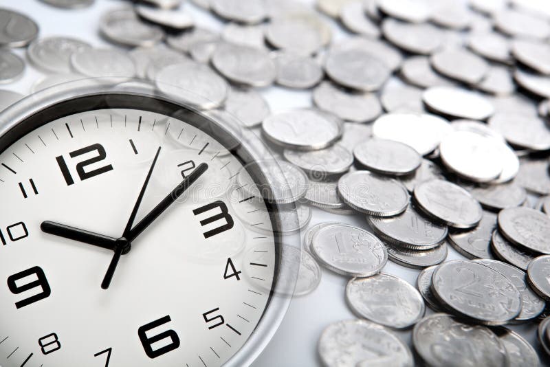 White clock face and Russian ruble coins closeup. White clock face and Russian ruble coins closeup