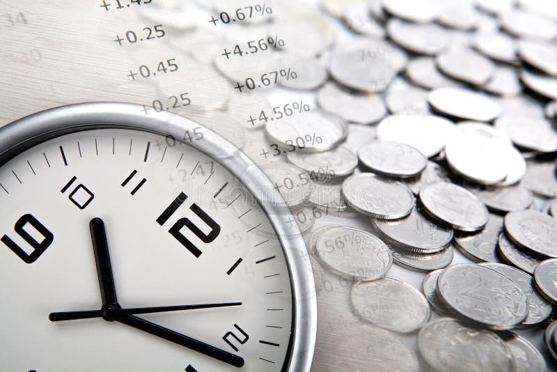 Pile of coins with digits and clock face close up. Pile of coins with digits and clock face close up