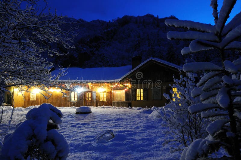 Rustic house in Alps, winter night. Rustic house in Alps, winter night