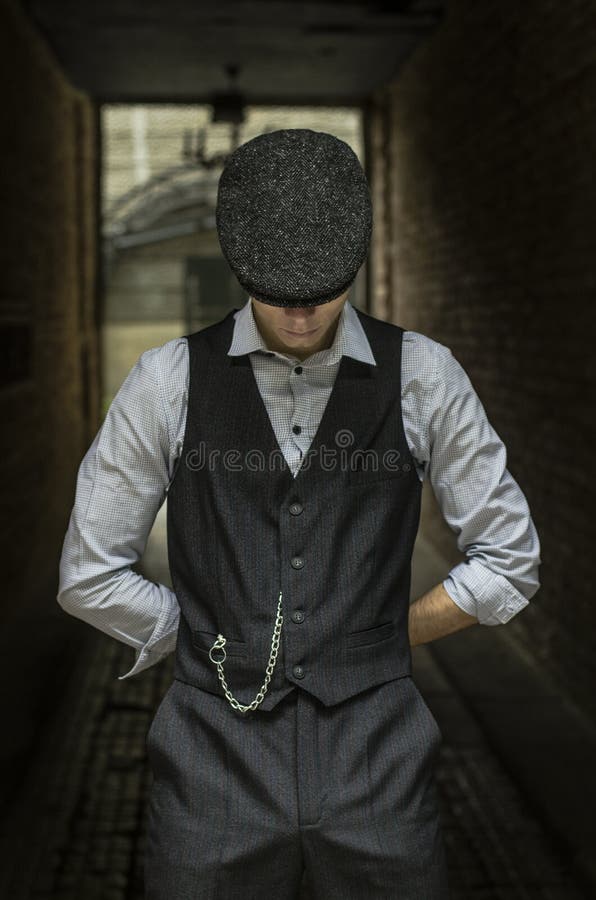 Mysterious Portrait of Retro 1920s English Gangster with Flat Cap ...