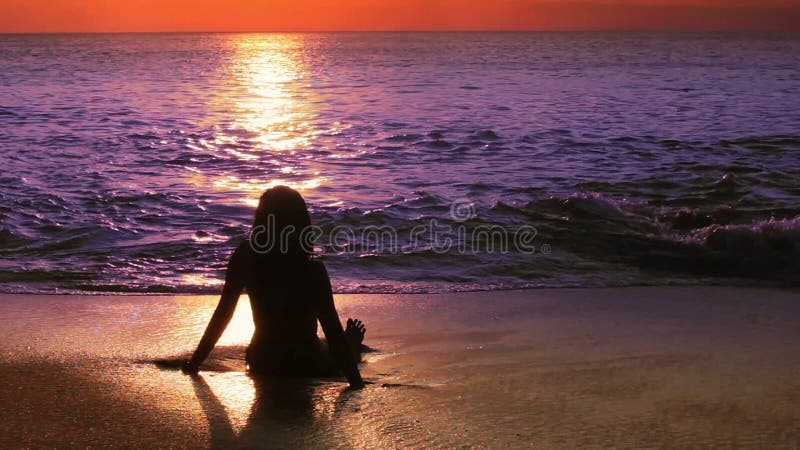 mysterious silhouette girl at beach during sunset