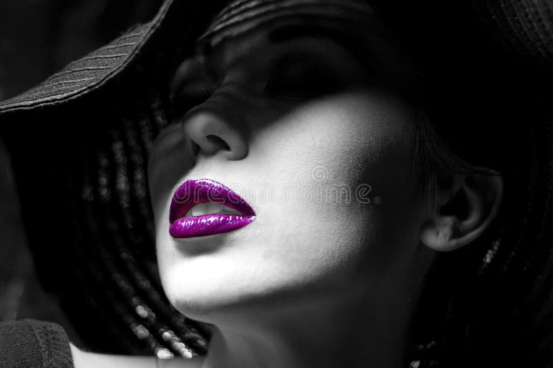 Mysterious woman in black hat. Purple lips stock photos Mysterious woman in black hat. Purple lips stock photos