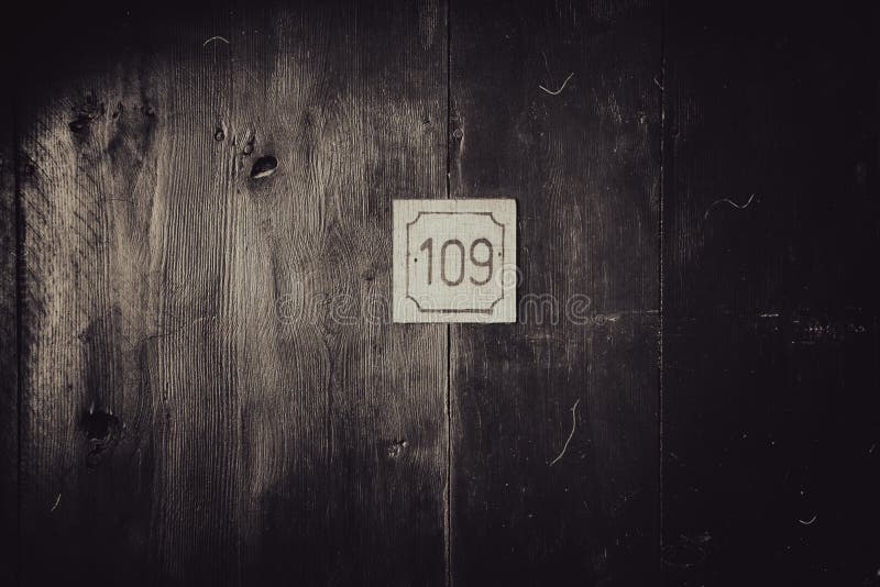 A Mysterious Wooden Antique Door with the Number 109 on it. Stock Image