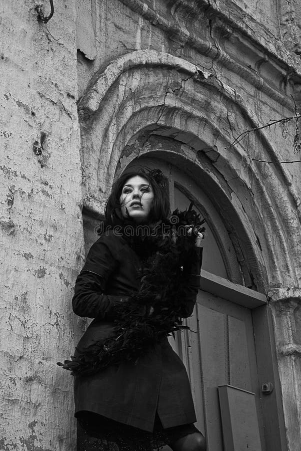 Mysterious young woman in black coat and fur royalty free stock photos Mysterious young woman in black coat and fur royalty free stock photos