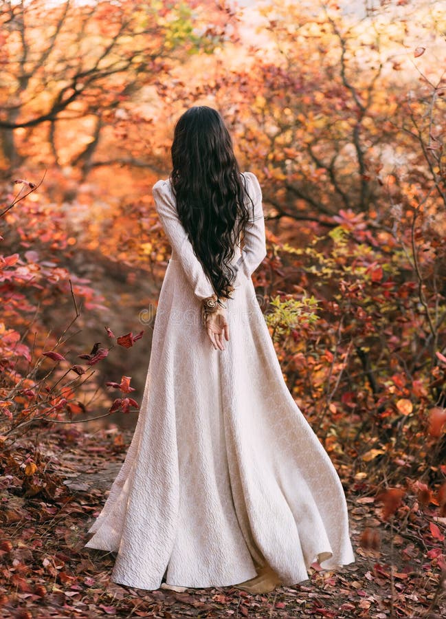 Mystery art portrait fantasy woman queen walking in gothic autumn forest, white vintage style dress. Girl princess long