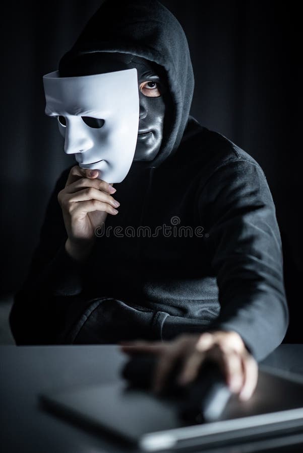 Mystery Man in Black Mask Holding White Masks Stock Image - Image