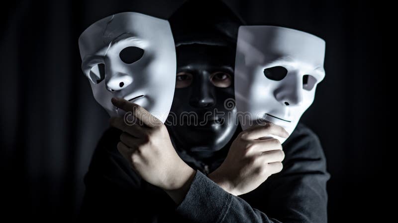 Mystery Man in Black Mask Holding White Masks Stock Image - Image