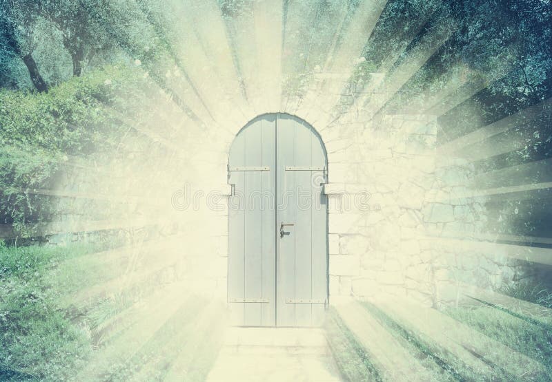 Mystic door in a dreamy rosegarden with sunbeam