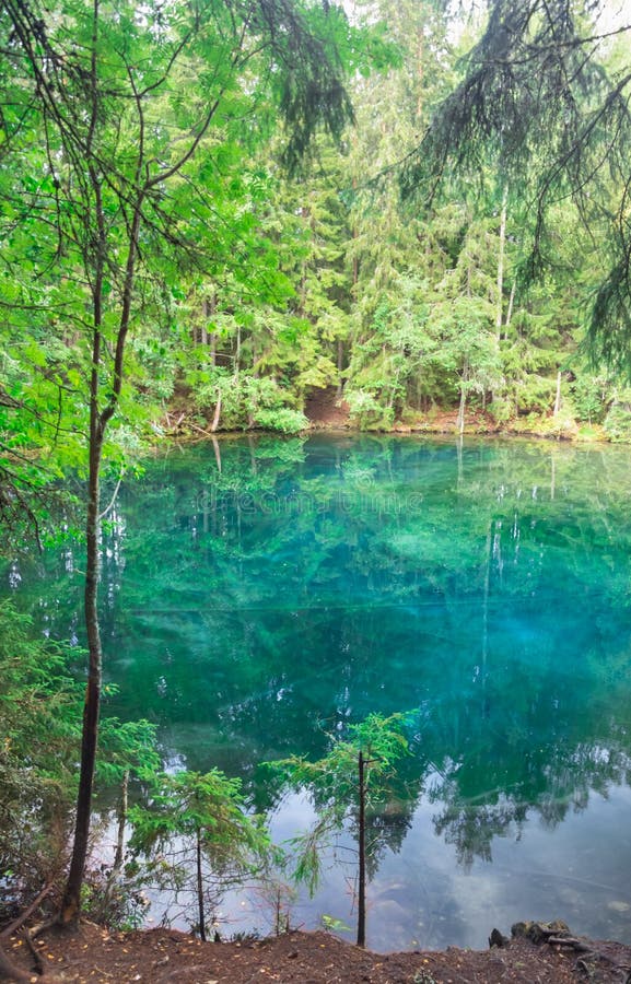 Mystically turquoise coloured spring Kiikunlahde in Hollola, Finland