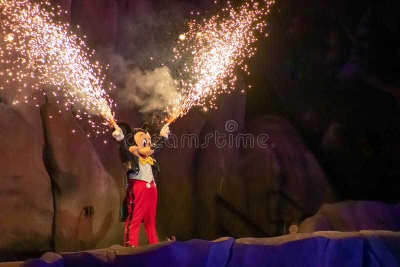 Orlando, Florida. March 19, 2019. Mickey mouse with fireworks coming out of his hands on Fantasmic Show at Hollywood Studios in  Walt Disney World  1. Orlando, Florida. March 19, 2019. Mickey mouse with fireworks coming out of his hands on Fantasmic Show at Hollywood Studios in  Walt Disney World  1