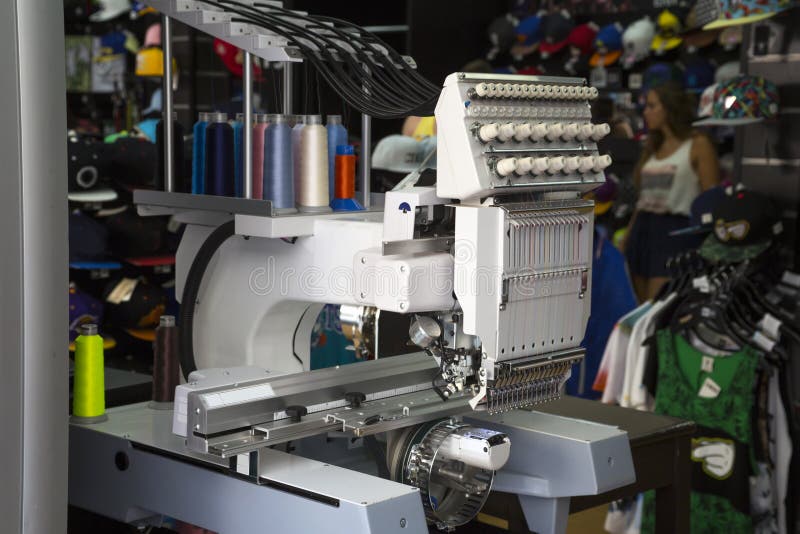 Embroidery machine with spools of color threads. Embroidery machine with spools of color threads