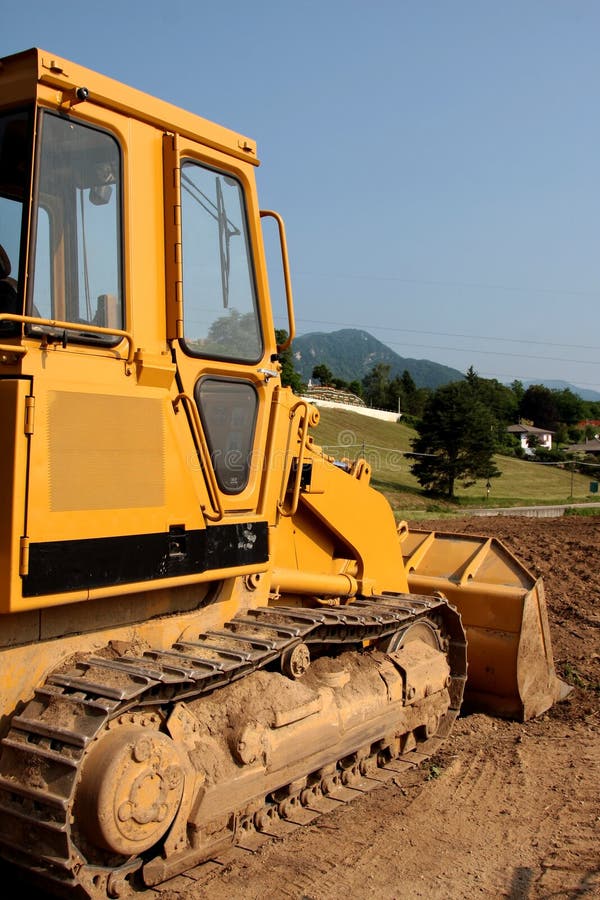 Escavadora amarela imagens de stock royalty free