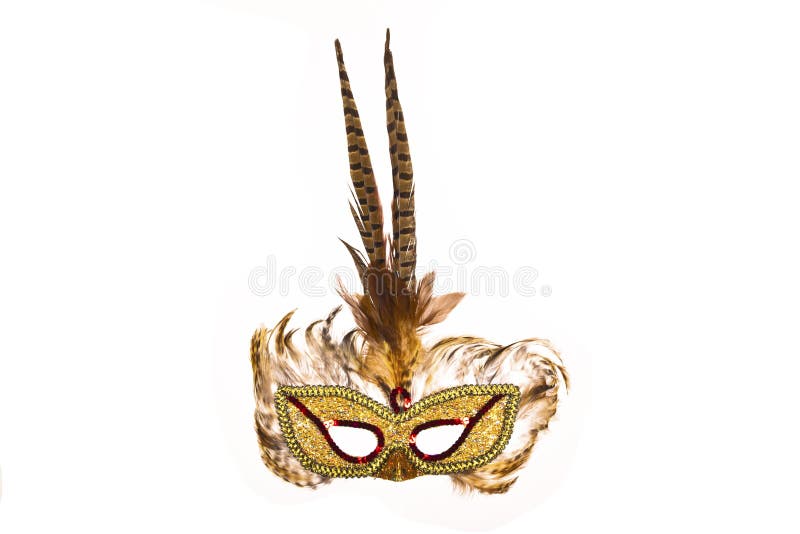 Brown carnaval mask made with feathers isolated on black. Brown carnaval mask made with feathers isolated on black