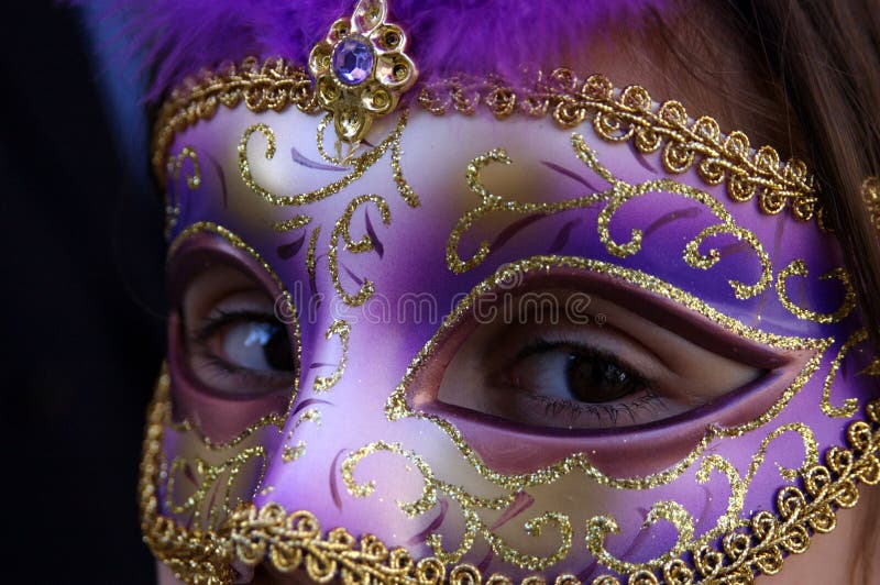 Golden purple Venice mask with mysterious eyes. Golden purple Venice mask with mysterious eyes