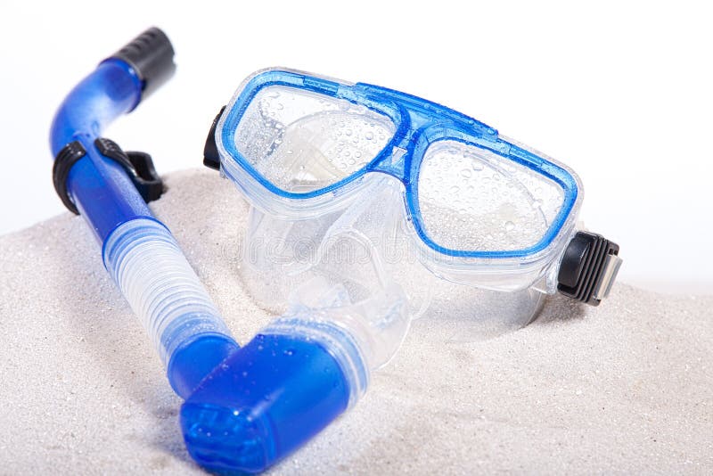 Scuba mask on the beach over sand. Scuba mask on the beach over sand