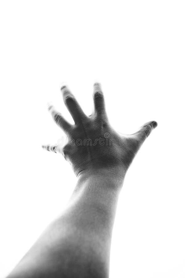 Mâna masculină care ajunge la lumină stock images