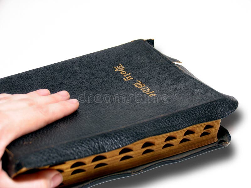 Mão e Bíblia imagem de stock Mão e Bíblia imagem de stock