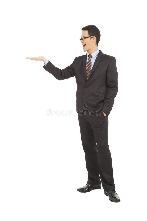 Mão orgulhosa do aumento do homem de negócios para mostrar algo foto de stock royalty free Mão orgulhosa do aumento do homem de negócios para mostrar algo foto de stock royalty free