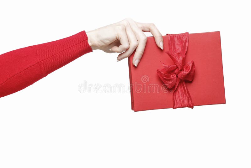 Mão que guarda a caixa atual vermelha imagens de stock royalty free Mão que guarda a caixa atual vermelha imagens de stock royalty free