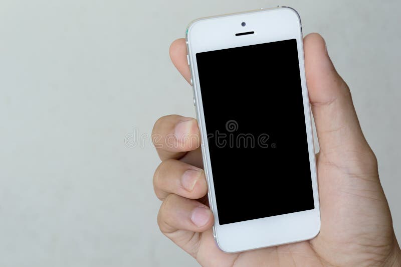 Mão que guarda o telefone com espaço da cópia fotos de stock royalty free Mão que guarda o telefone com espaço da cópia fotos de stock royalty free