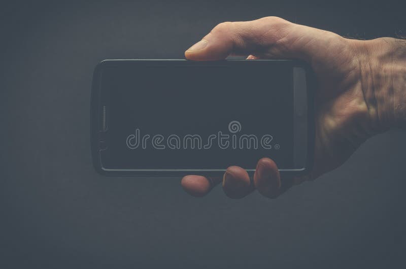 Mão que guardara o telemóvel fotos de stock Mão que guardara o telemóvel fotos de stock