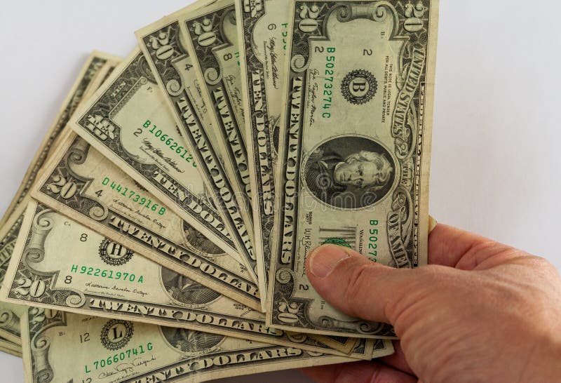 Mão que mostra uma série de dólares fotografia de stock royalty free
