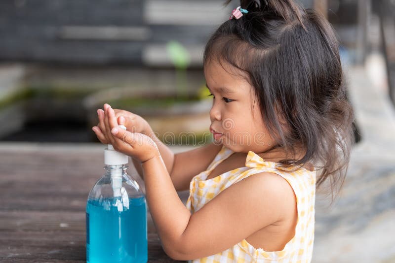 Child Hands Using Wash Hand Sanitizer Gel Pump Dispenser, Selected Focus. Child Hands Using Wash Hand Sanitizer Gel Pump Dispenser, Selected Focus