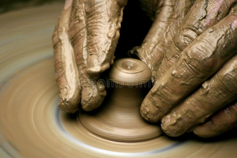 Hands of the potter on potter's wheel. Hands of the potter on potter's wheel