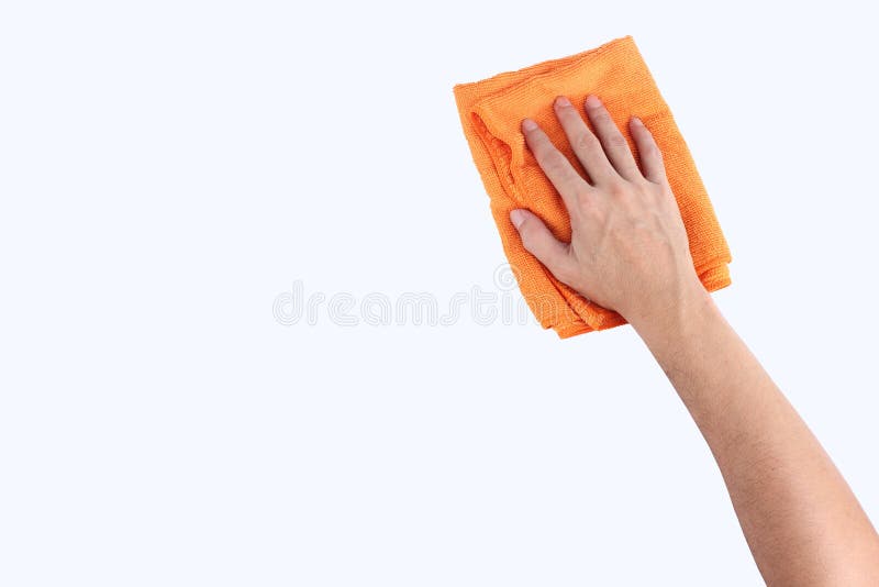Mãos que mantêm o pano do microfiber de pano da limpeza isolado nos vagabundos brancos imagem de stock Mãos que mantêm o pano do microfiber de pano da limpeza isolado nos vagabundos brancos imagem de stock
