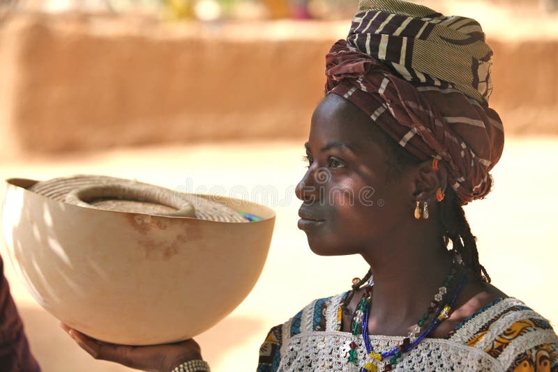 Fulani girl in Africa with a Calabas. Fulani girl in Africa with a Calabas