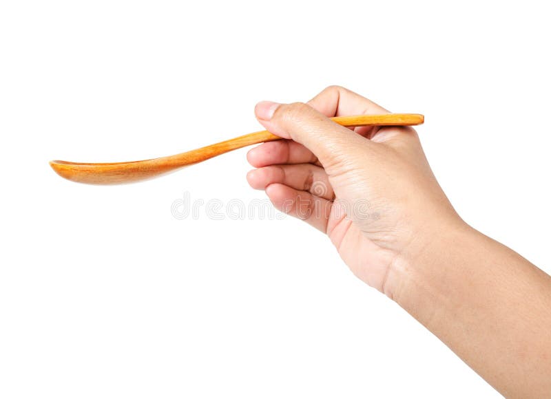 Männliche Hand, die einen leeren hölzernen Löffel hält stockfotos Männliche Hand, die einen leeren hölzernen Löffel hält stockfotos