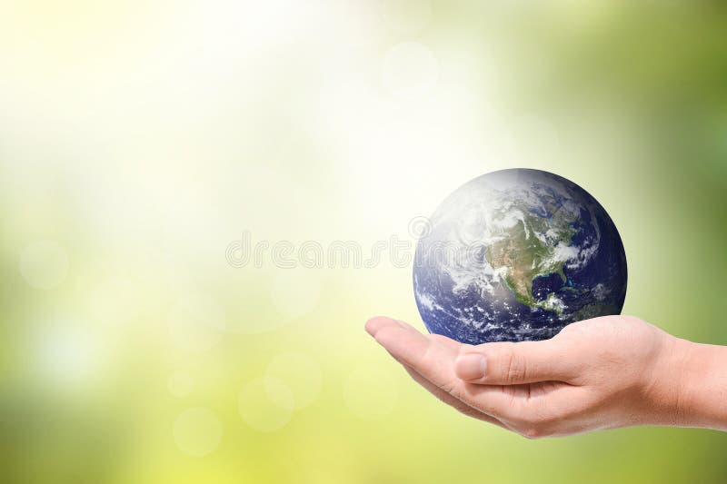 Männliche Hand, welche die Erde anhält lizenzfreies stockbild Männliche Hand, welche die Erde anhält lizenzfreies stockbild