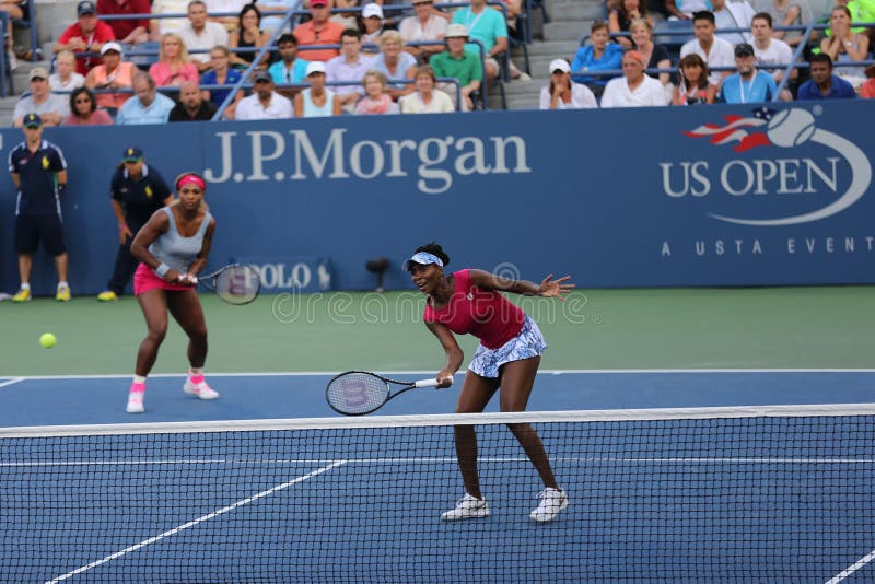 NEW YORK - AUGUST 28: Grand Slam champions Serena Williams and Venus Williams during doubles match at US Open 2014 at National Tennis Center on August 28, 2014 in New York. NEW YORK - AUGUST 28: Grand Slam champions Serena Williams and Venus Williams during doubles match at US Open 2014 at National Tennis Center on August 28, 2014 in New York