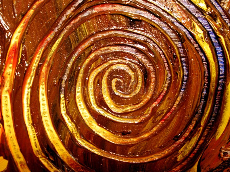 Real fresh oil paint spiral swirls on canvas in browns,yellows,blues, and reds. Perfect as a background, layer or texture. Real fresh oil paint spiral swirls on canvas in browns,yellows,blues, and reds. Perfect as a background, layer or texture