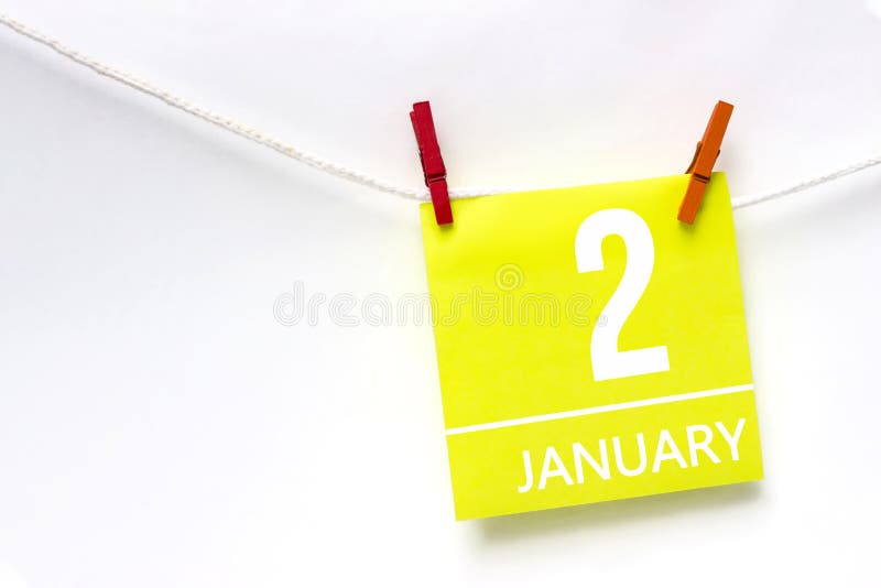 January 2nd. Day 2 of month, Calendar date. Paper cards with calendar day hanging rope with clothespins on white background. Winter month, day of the year concept. January 2nd. Day 2 of month, Calendar date. Paper cards with calendar day hanging rope with clothespins on white background. Winter month, day of the year concept