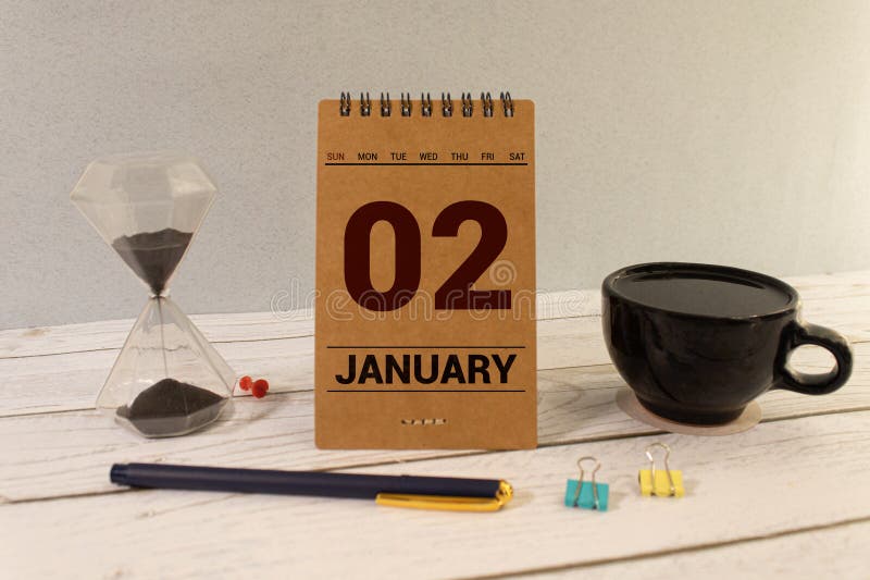 January 2nd.January 2 white wooden calendar on wood background.Copyspace for your text.Winter day. January 2nd.January 2 white wooden calendar on wood background.Copyspace for your text.Winter day.