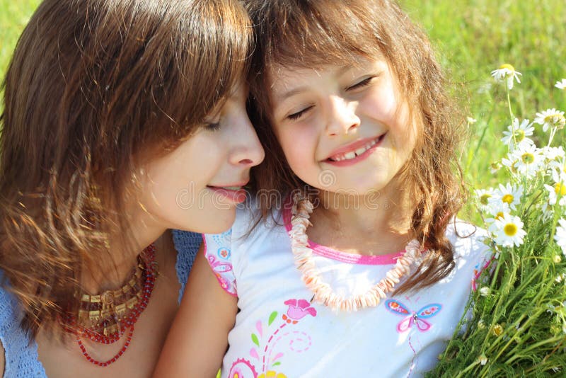 Mother resting outdoor with daughter. Mother resting outdoor with daughter