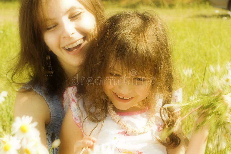 Mother resting outdoor with daughter. Mother resting outdoor with daughter