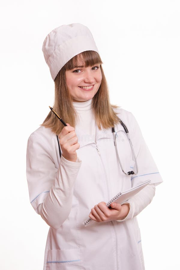 Médecin conseil sous forme de travail avec un carnet et un stylo photos libres de droits Médecin conseil sous forme de travail avec un carnet et un stylo photos libres de droits