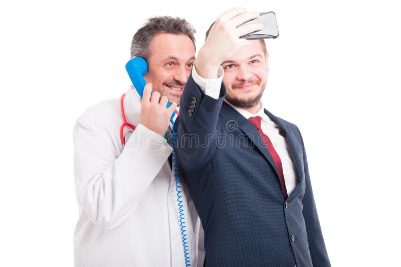 Médico profesional y abogado que toman un selfie fotografía de archivo libre de regalías Médico profesional y abogado que toman un selfie fotografía de archivo libre de regalías