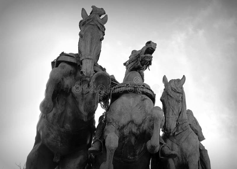 A view of three horse statues from below as they charge forward. Part of the Ulysses S. Grant Memorial behind the Capitol Building in Washington DC. A view of three horse statues from below as they charge forward. Part of the Ulysses S. Grant Memorial behind the Capitol Building in Washington DC.