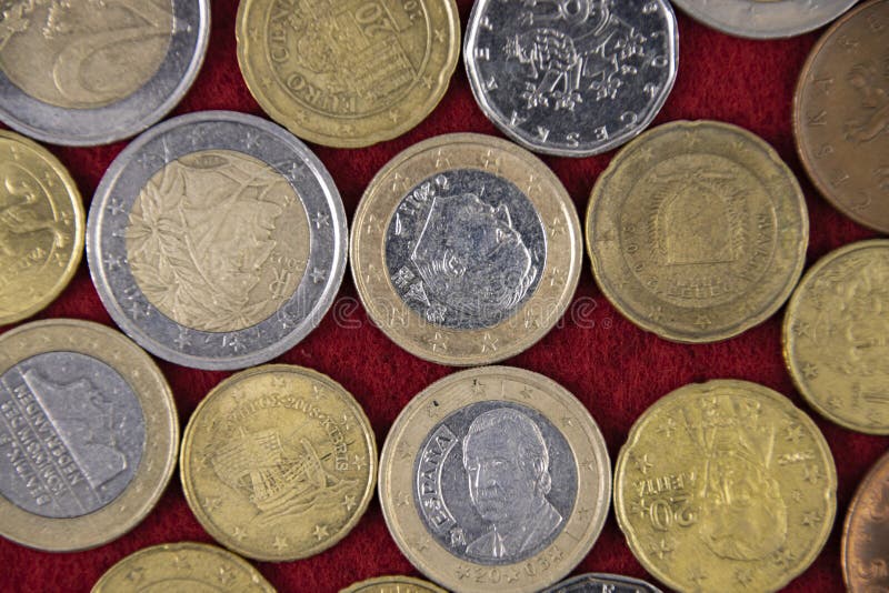 Pattern of European coins on a red cloth, top view,flat lay. Pattern of European coins on a red cloth, top view,flat lay.