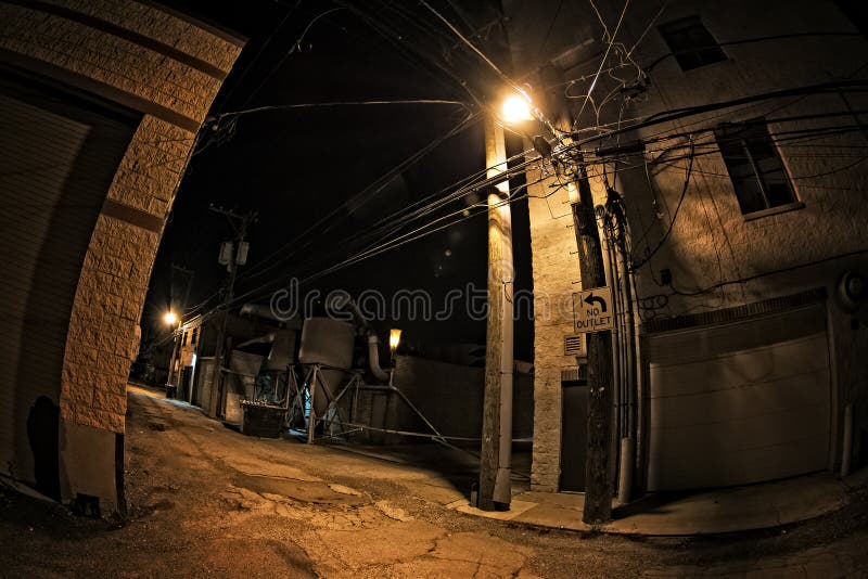 Dark industrial urban city alley at night. Dark industrial urban city alley at night
