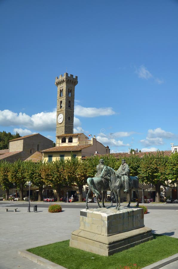 The statue of Garibaldi and King Vittorio Emanuele II from Fiesole, Italy. In the back a campanile tower can be observed. The statue of Garibaldi and King Vittorio Emanuele II from Fiesole, Italy. In the back a campanile tower can be observed.