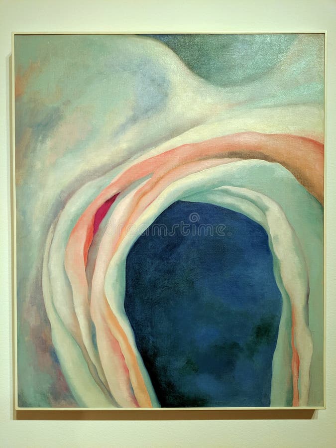 Seattle - May 16, 2019: Music, Pink, and Blue is an abstract oil painting by Georgia O’Keeffe from 1918. It shows bright colors blending on a blue background to evoke musical sounds. The painting is 35 by 29 inches and was displayed at the Seattle Art Museum on a touring exhibit. Seattle - May 16, 2019: Music, Pink, and Blue is an abstract oil painting by Georgia O’Keeffe from 1918. It shows bright colors blending on a blue background to evoke musical sounds. The painting is 35 by 29 inches and was displayed at the Seattle Art Museum on a touring exhibit