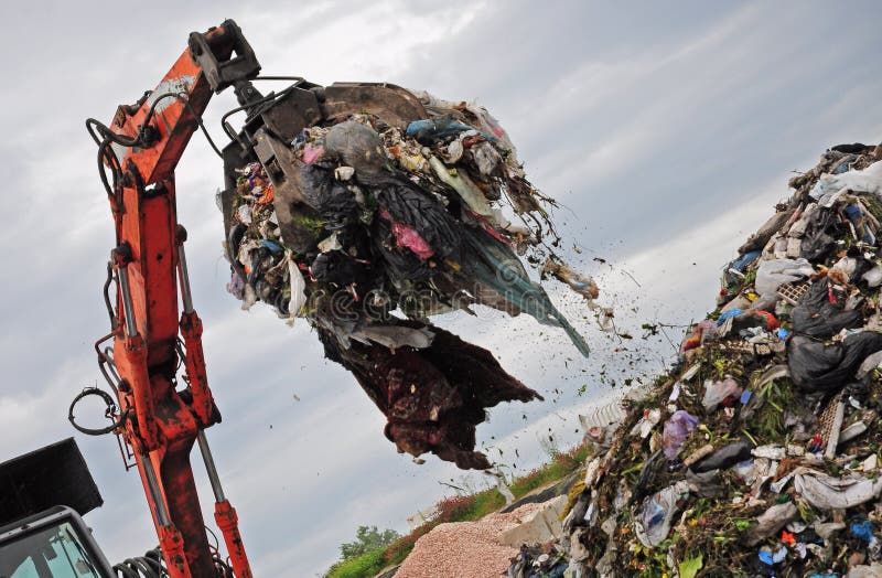 Machine working with garbage in landfill. Machine working with garbage in landfill