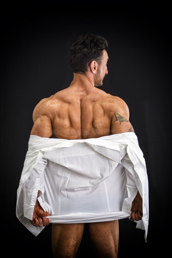 Męski bodybuilder rozbiera się odkrywczego mięśniowego plecy obrazy stock Męski bodybuilder rozbiera się odkrywczego mięśniowego plecy obrazy stock
