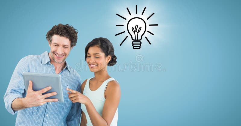 Digital composite of Man and women with tablet and lightbulb doodle with flare against blue background. Digital composite of Man and women with tablet and lightbulb doodle with flare against blue background