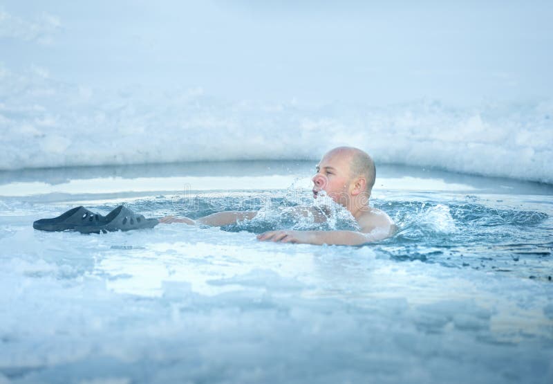 Man bathing in the ice cold water. Man bathing in the ice cold water