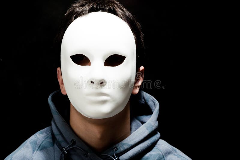 Young man with white mask, studio shot. Young man with white mask, studio shot